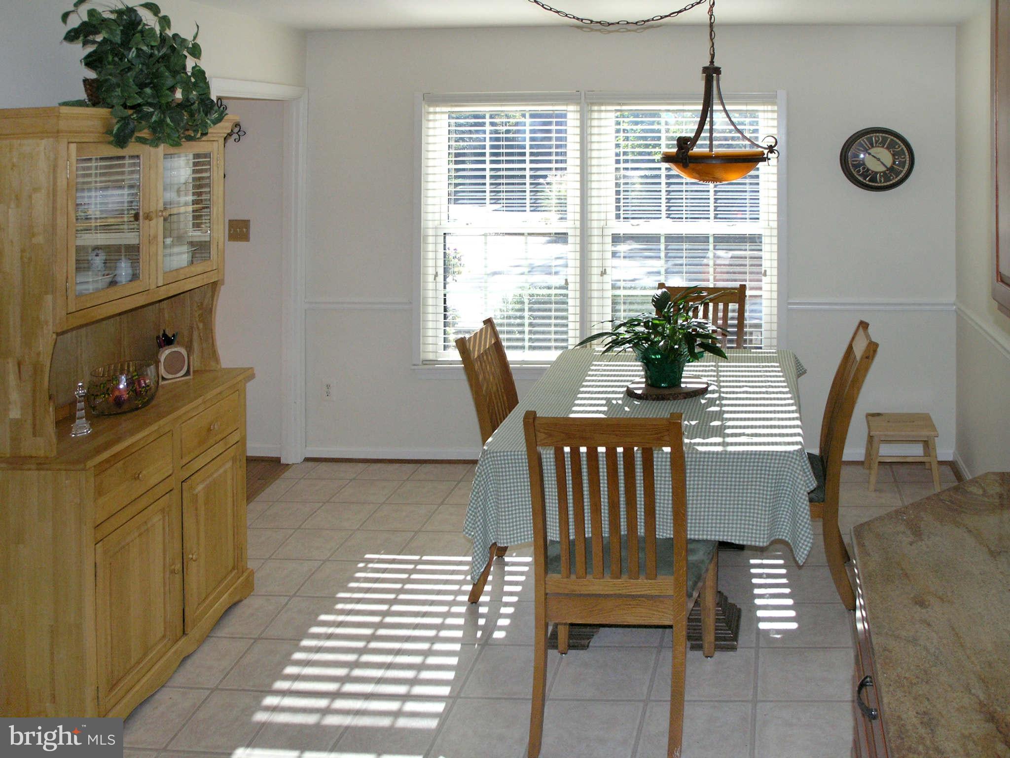 2168 Golf Course Drive Reston, VA 20191 - Photo 11 of 30 a view of a dining room with furniture and window