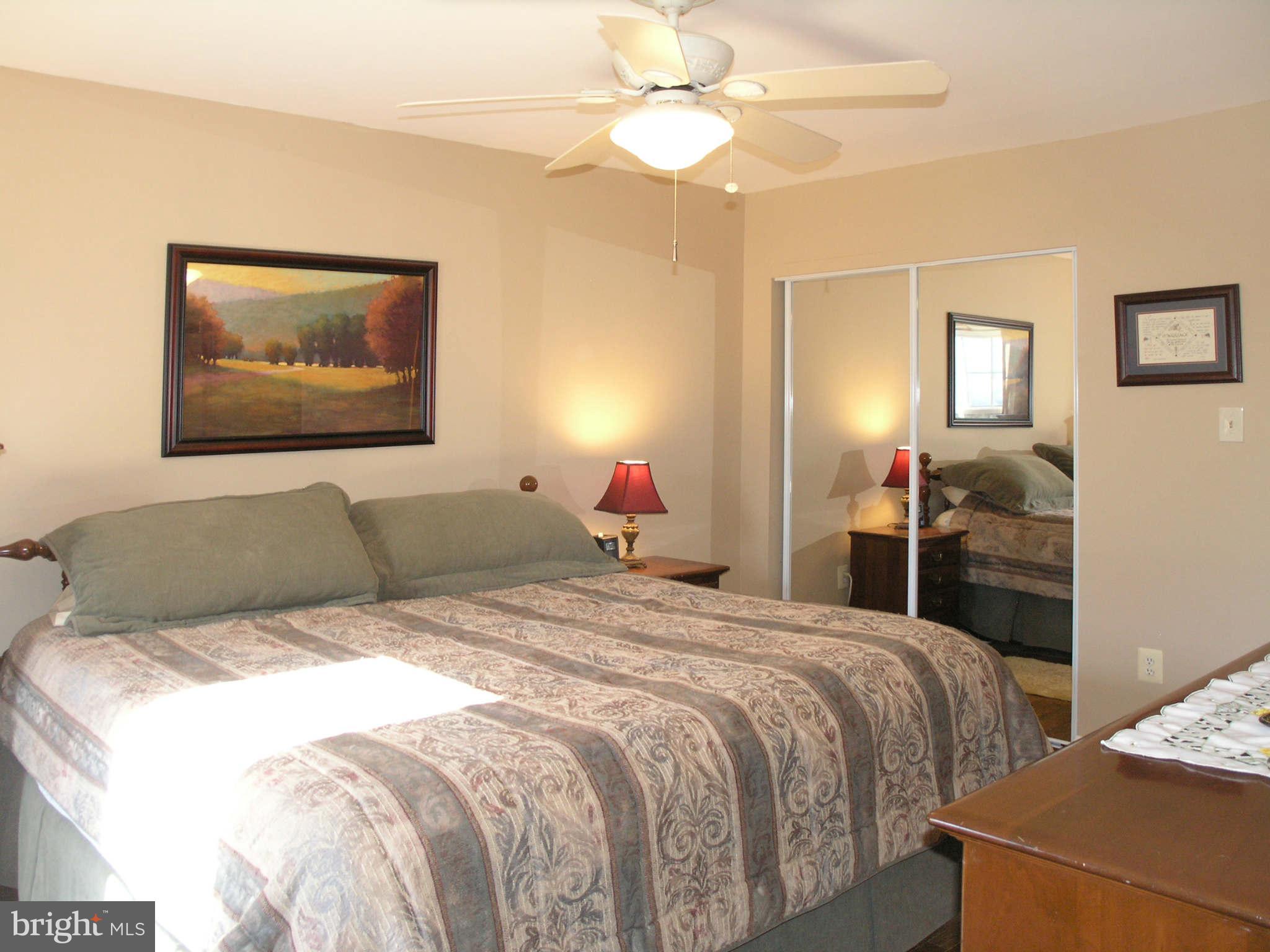 2168 Golf Course Drive Reston, VA 20191 - Photo 13 of 30 a bedroom with a bed and a chandelier