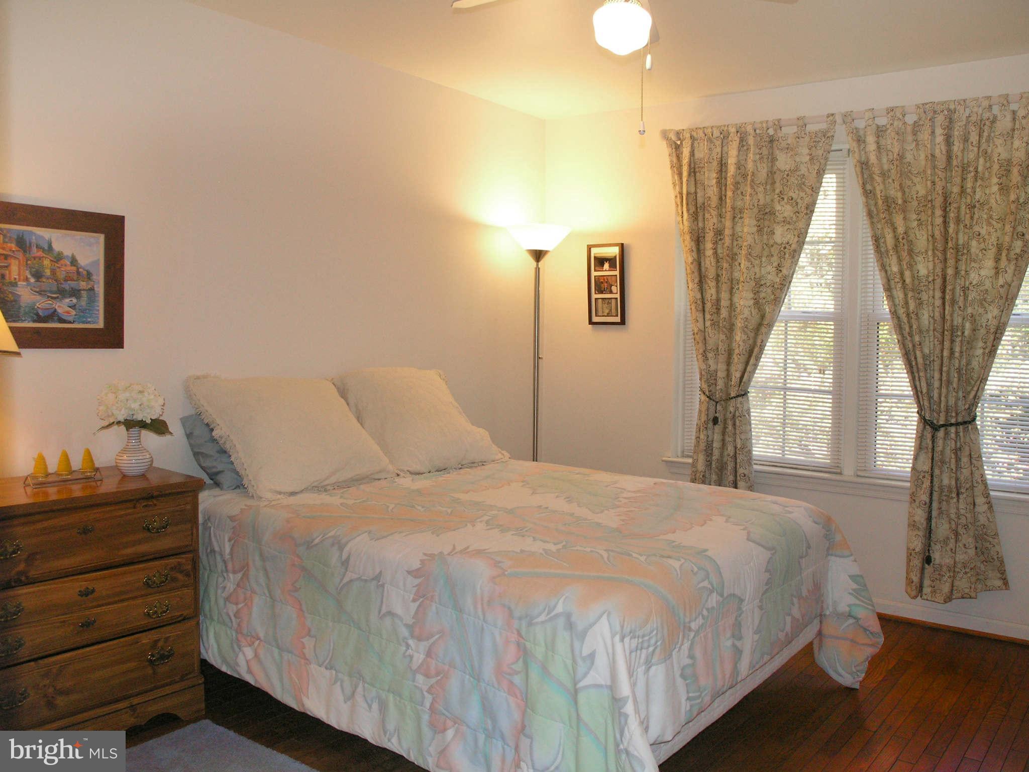 2168 Golf Course Drive Reston, VA 20191 - Photo 15 of 30 a bedroom with a bed and a window