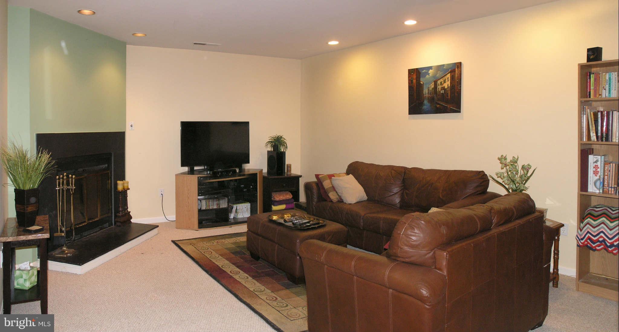 2168 Golf Course Drive Reston, VA 20191 - Photo 18 of 30 a living room with furniture and a flat screen tv