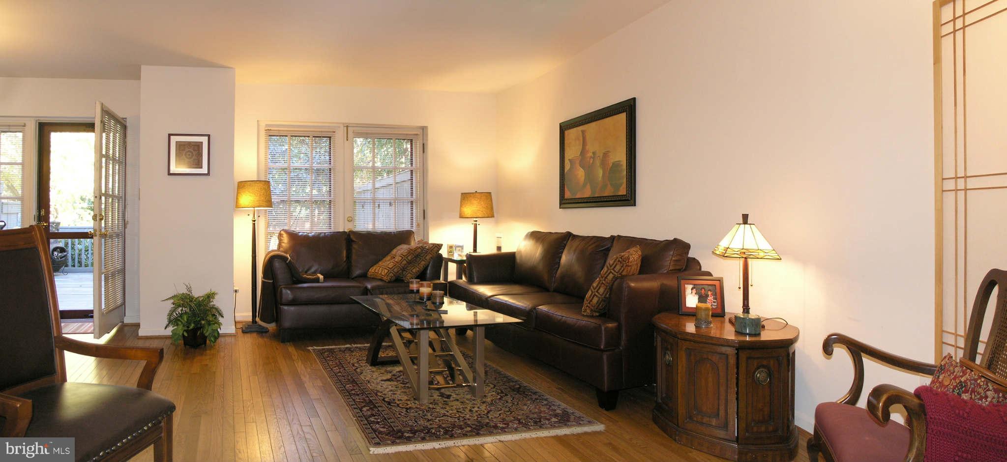2168 Golf Course Drive Reston, VA 20191 - Photo 4 of 30 a living room with furniture rug and wooden floor
