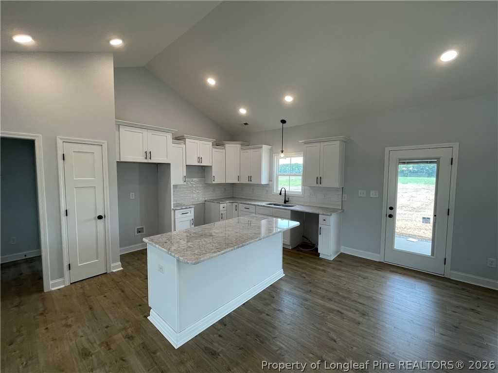 1075 Purdie-Hall Road Tar Heel, NC 28392 - Photo 5 of 28 a large kitchen with stainless steel appliances granite countertop a large counter top a sink and a refrigerator