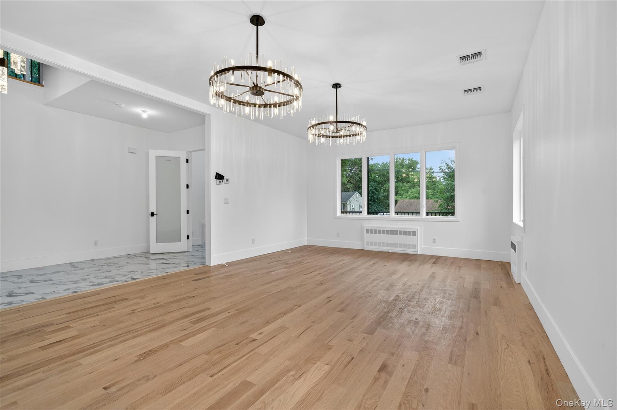 3 Forshee Street Monroe, NY 10950 - Photo 11 of 43 a view of an empty room with a window and wooden floor