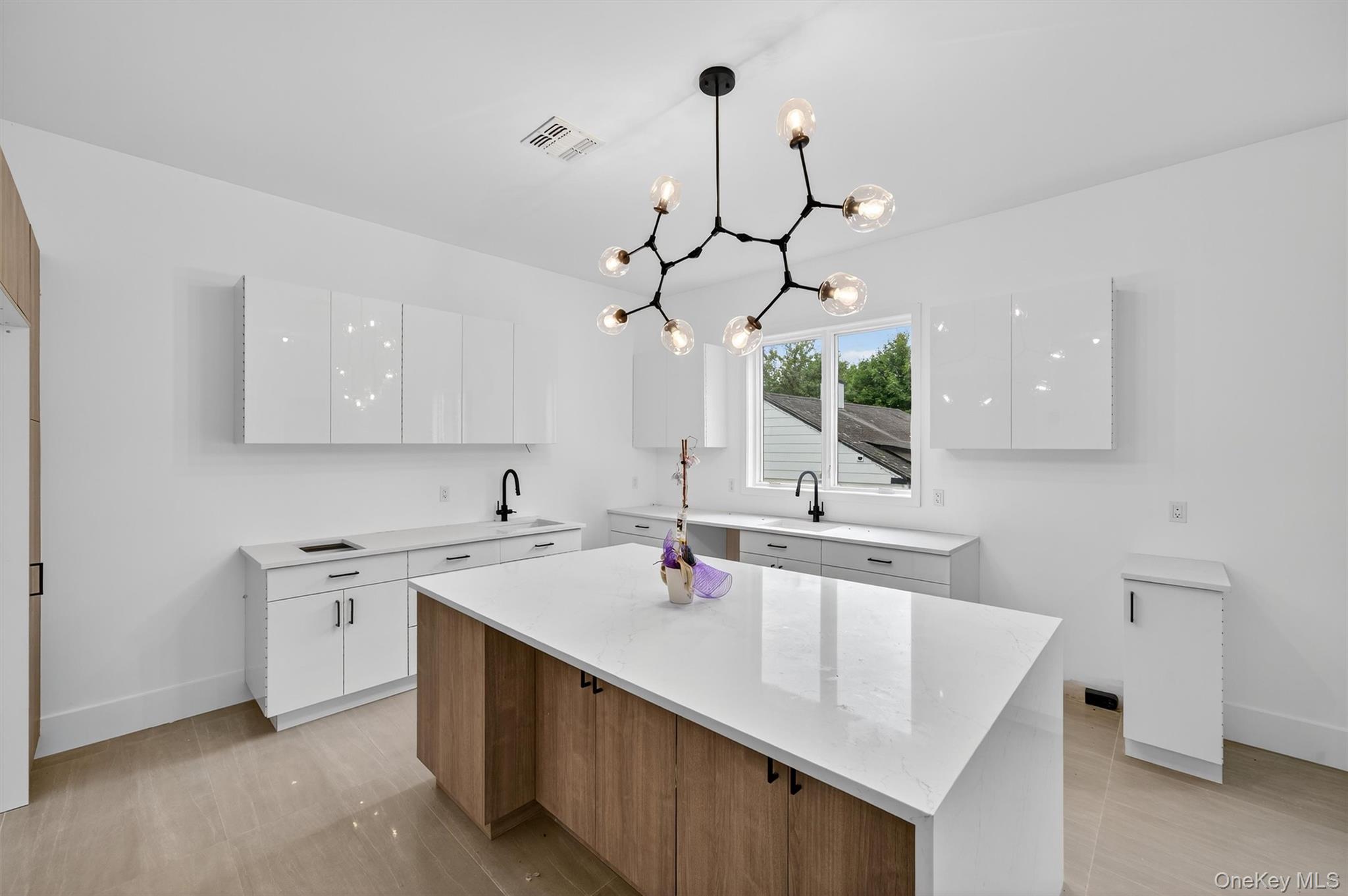 3 Forshee Street Monroe, NY 10950 - Photo 13 of 43 a kitchen with a sink kitchen island and stainless steel appliances