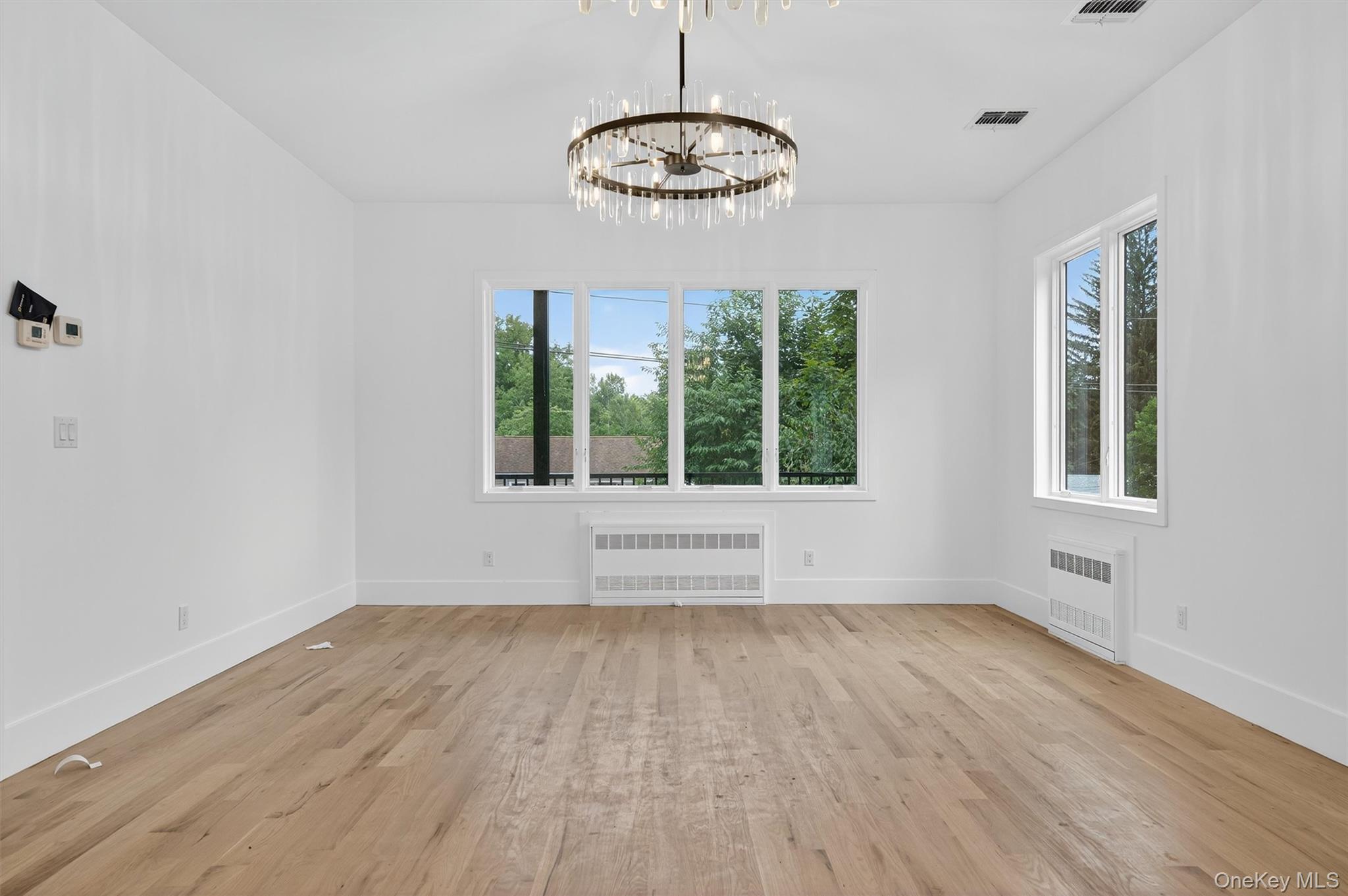 3 Forshee Street Monroe, NY 10950 - Photo 16 of 43 a view of an empty room with wooden floor and a window