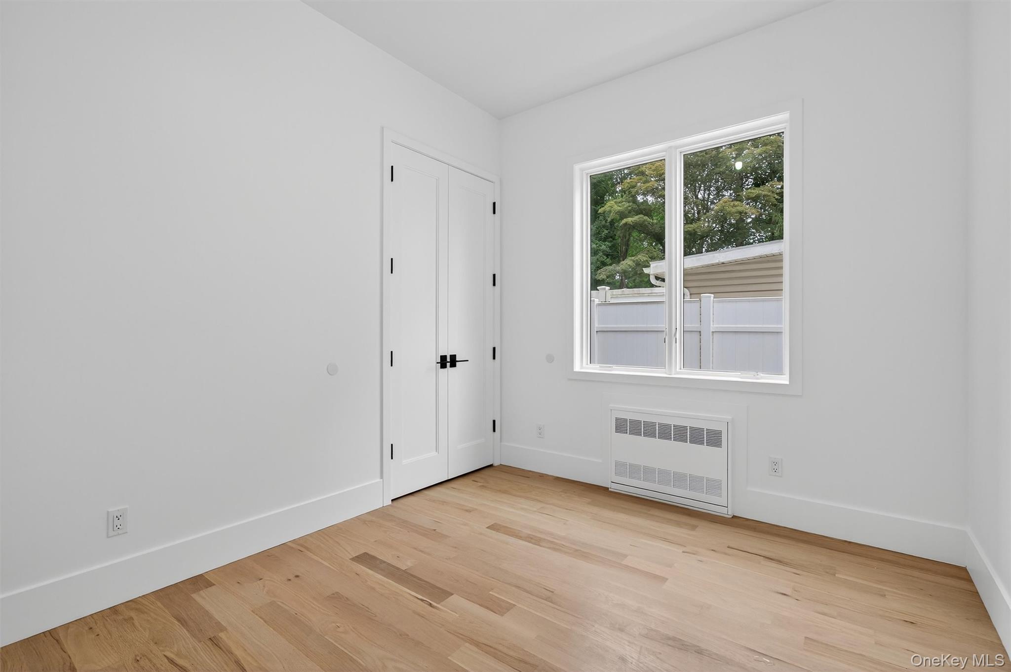 3 Forshee Street Monroe, NY 10950 - Photo 20 of 43 an empty room with wooden floor and windows