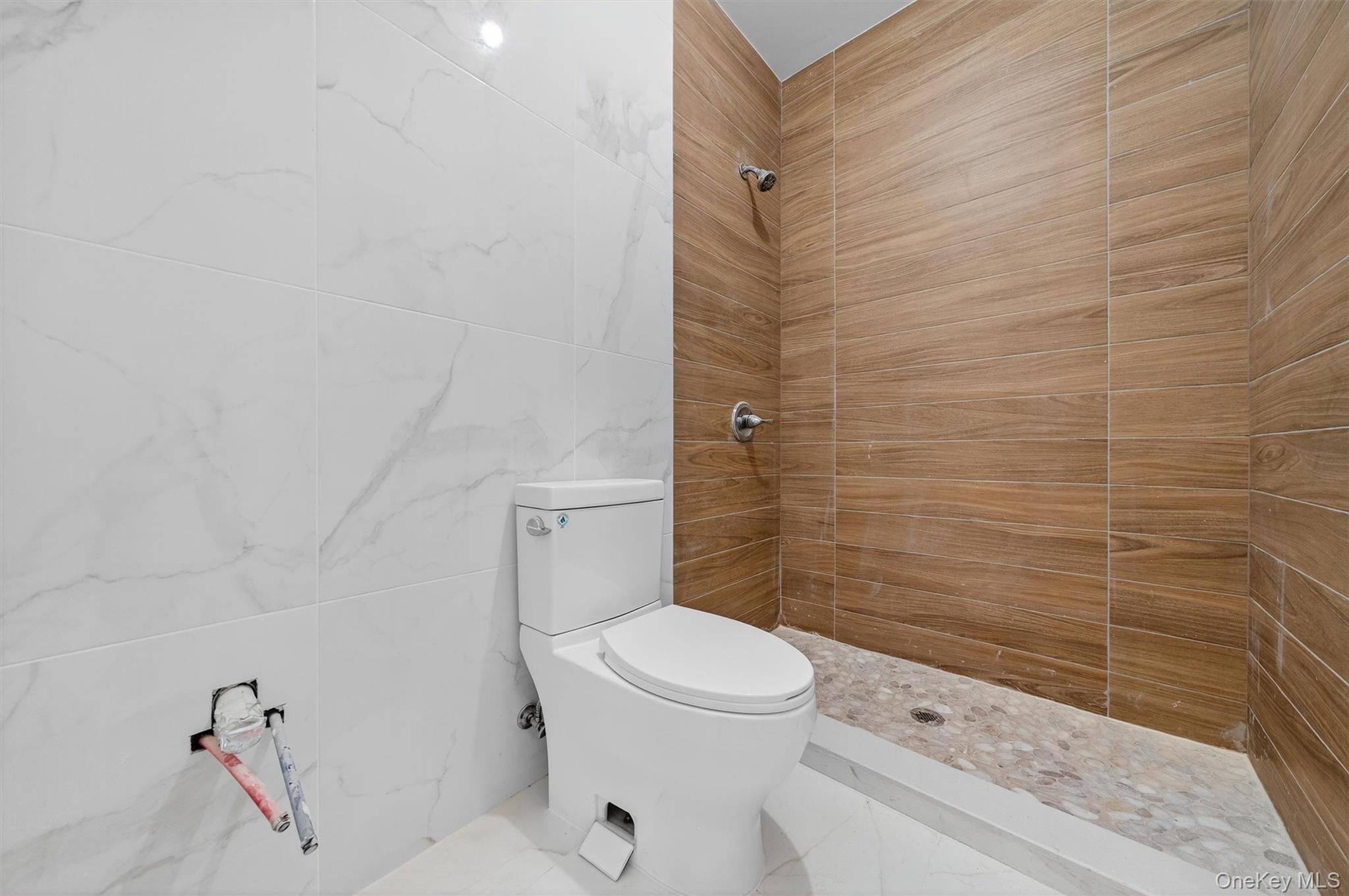 3 Forshee Street Monroe, NY 10950 - Photo 28 of 43 a bathroom with a toilet and a shower