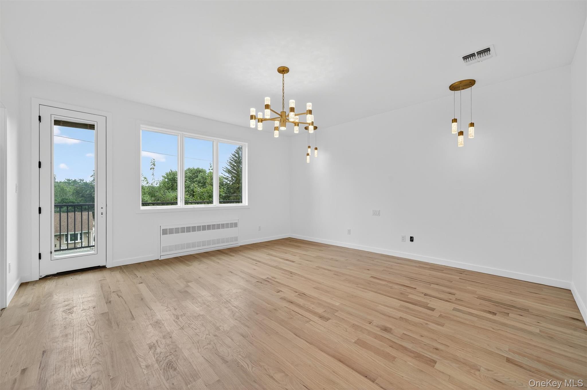 3 Forshee Street Monroe, NY 10950 - Photo 29 of 43 wooden floor in an empty room with a window