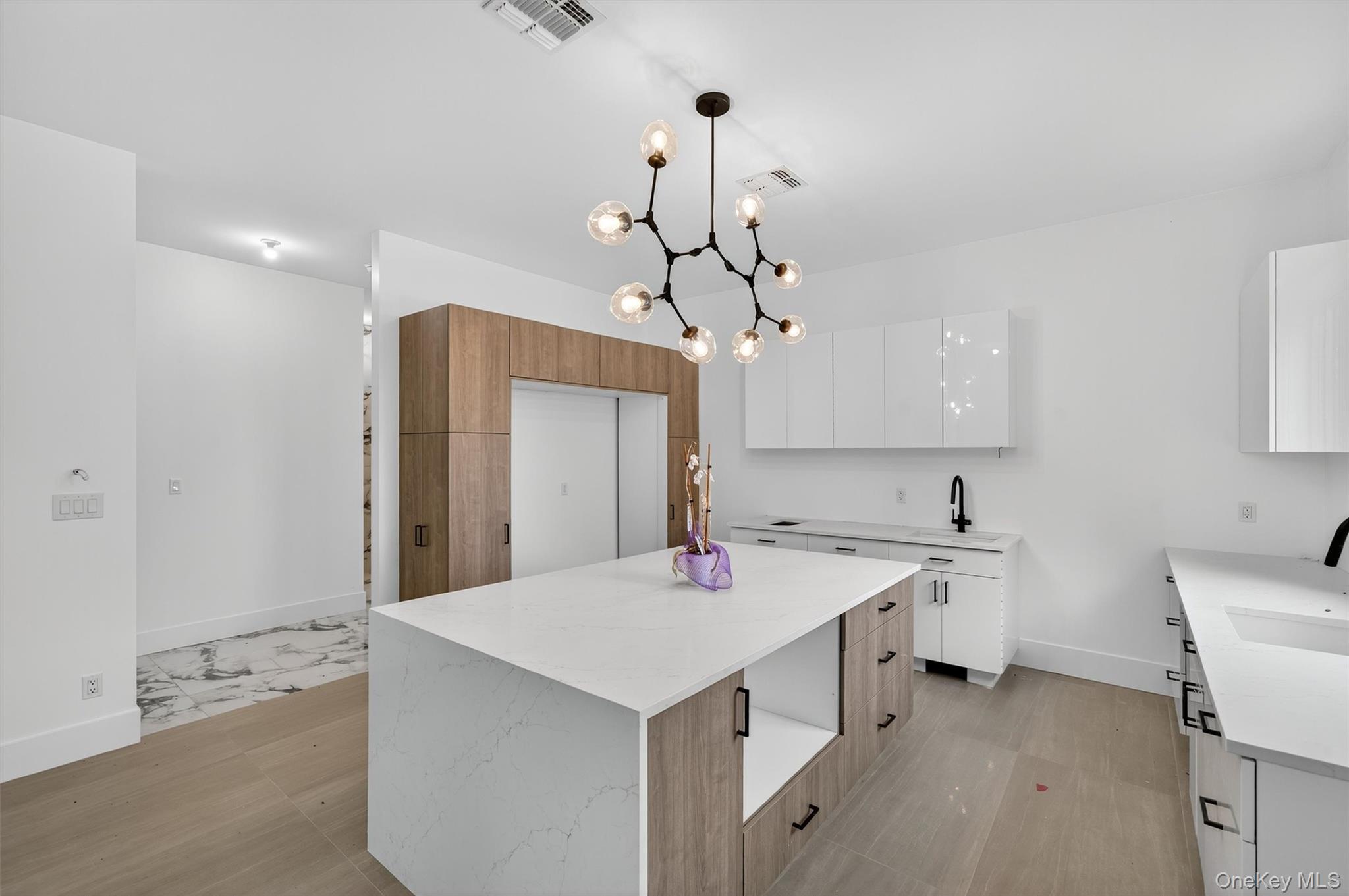 3 Forshee Street Monroe, NY 10950 - Photo 10 of 43 a kitchen with a sink a counter top space and stainless steel appliances
