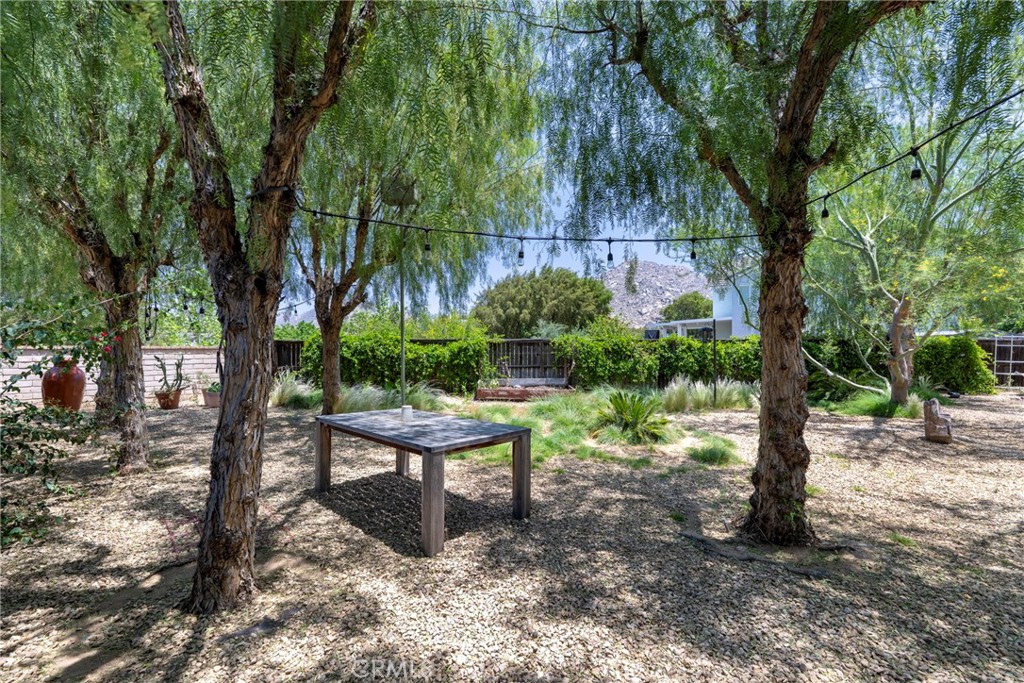 3819 St Austell Way Perris, CA 92571 - Photo 55 of 64 a view of a bench in a garden