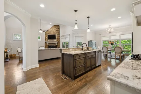 a kitchen with a table and chairs