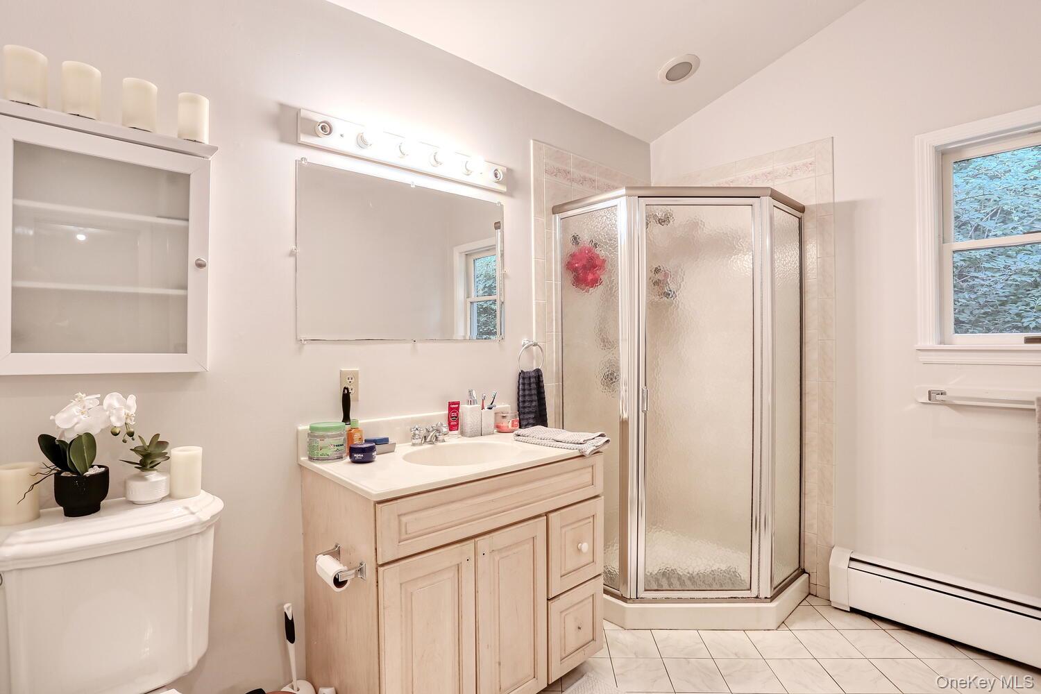 329 Call Hollow Road Haverstraw, NY 10980 - Photo 13 of 28 Bathroom featuring a baseboard radiator, lofted ceiling, a stall shower, vanity, and tile patterned floors