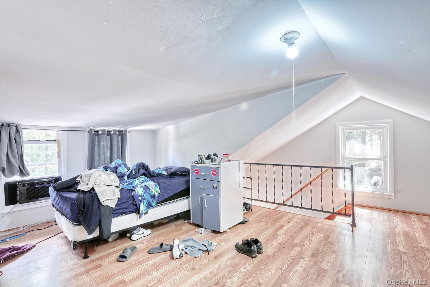 329 Call Hollow Road Haverstraw, NY 10980 - Photo 17 of 28 Bedroom featuring multiple windows, light wood finished floors, and lofted ceiling