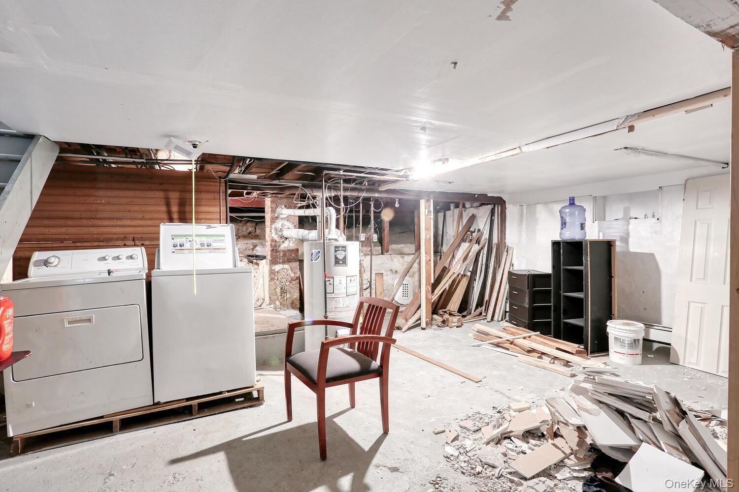 329 Call Hollow Road Haverstraw, NY 10980 - Photo 18 of 28 Unfinished below grade area featuring washer and clothes dryer and gas water heater