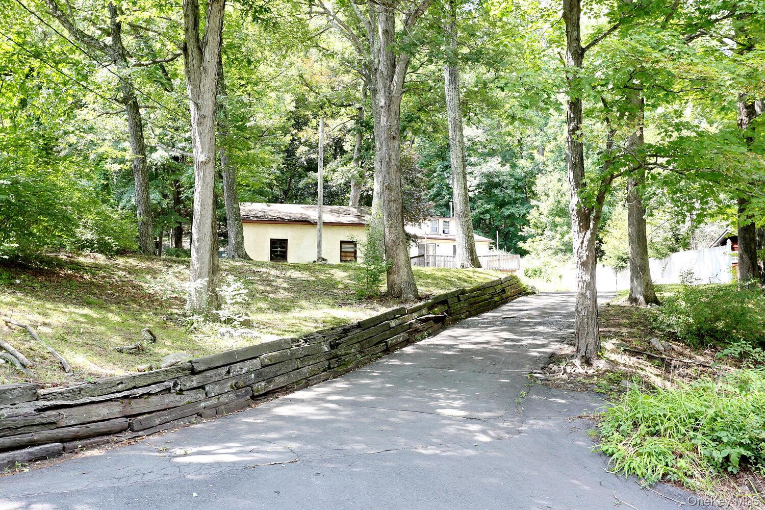 329 Call Hollow Road Haverstraw, NY 10980 - Photo 23 of 28 Ranch-style house with stucco siding and driveway