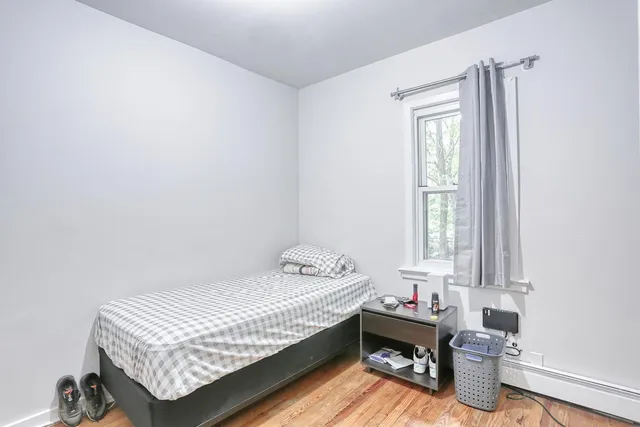 a room with a bed and a window