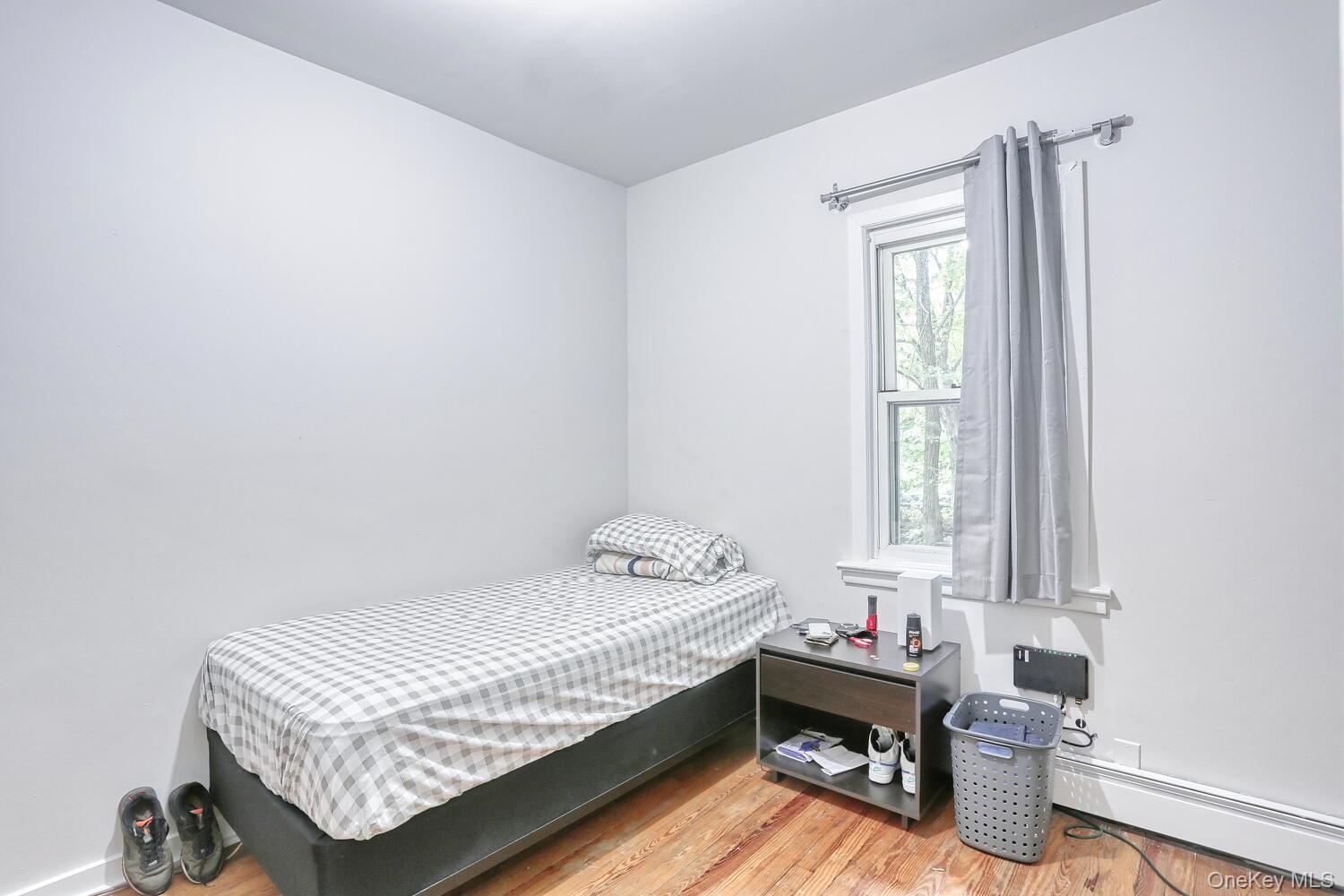 329 Call Hollow Road Haverstraw, NY 10980 - Photo 8 of 28 Bedroom with wood finished floors and baseboard heating