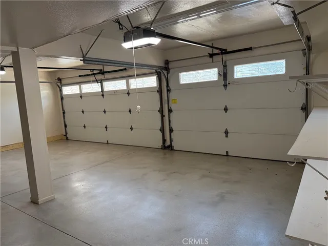 a view of a livingroom with furniture and a ceiling fan