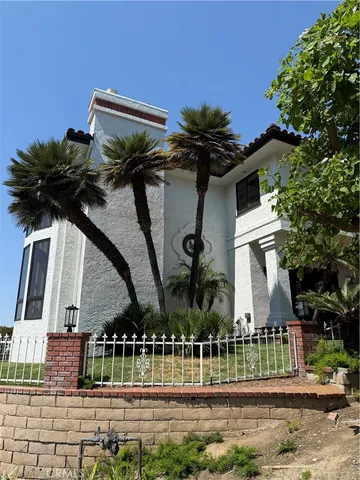 a house view with a garden space
