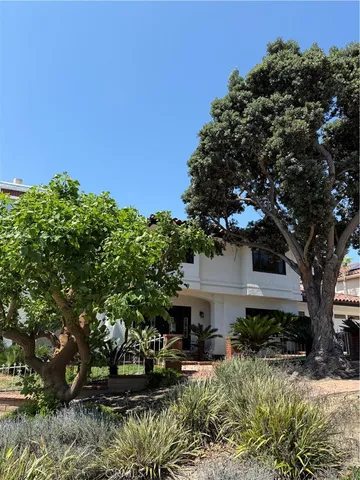 a view of a dining room with furniture a rug and a large window