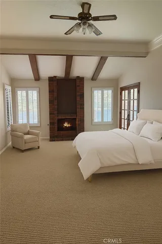 a room with furniture and a fan