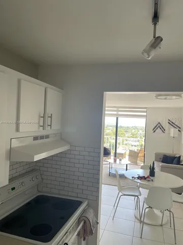 a bathroom with a sink a large mirror and a bathtub