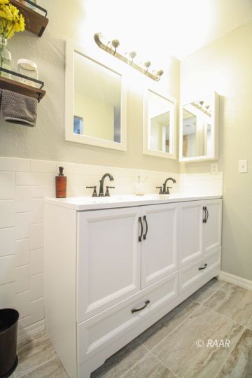 1124 Faith Court Ridgecrest, CA 93555 - Photo 28 of 35 a bathroom with a sink and a mirror