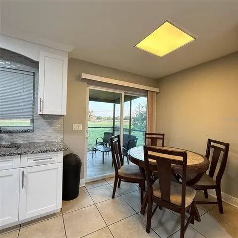 a kitchen with a stove a sink and a refrigerator