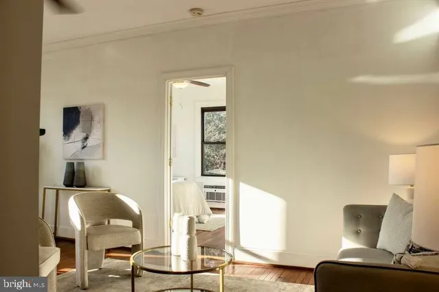 a living room with furniture and a chair