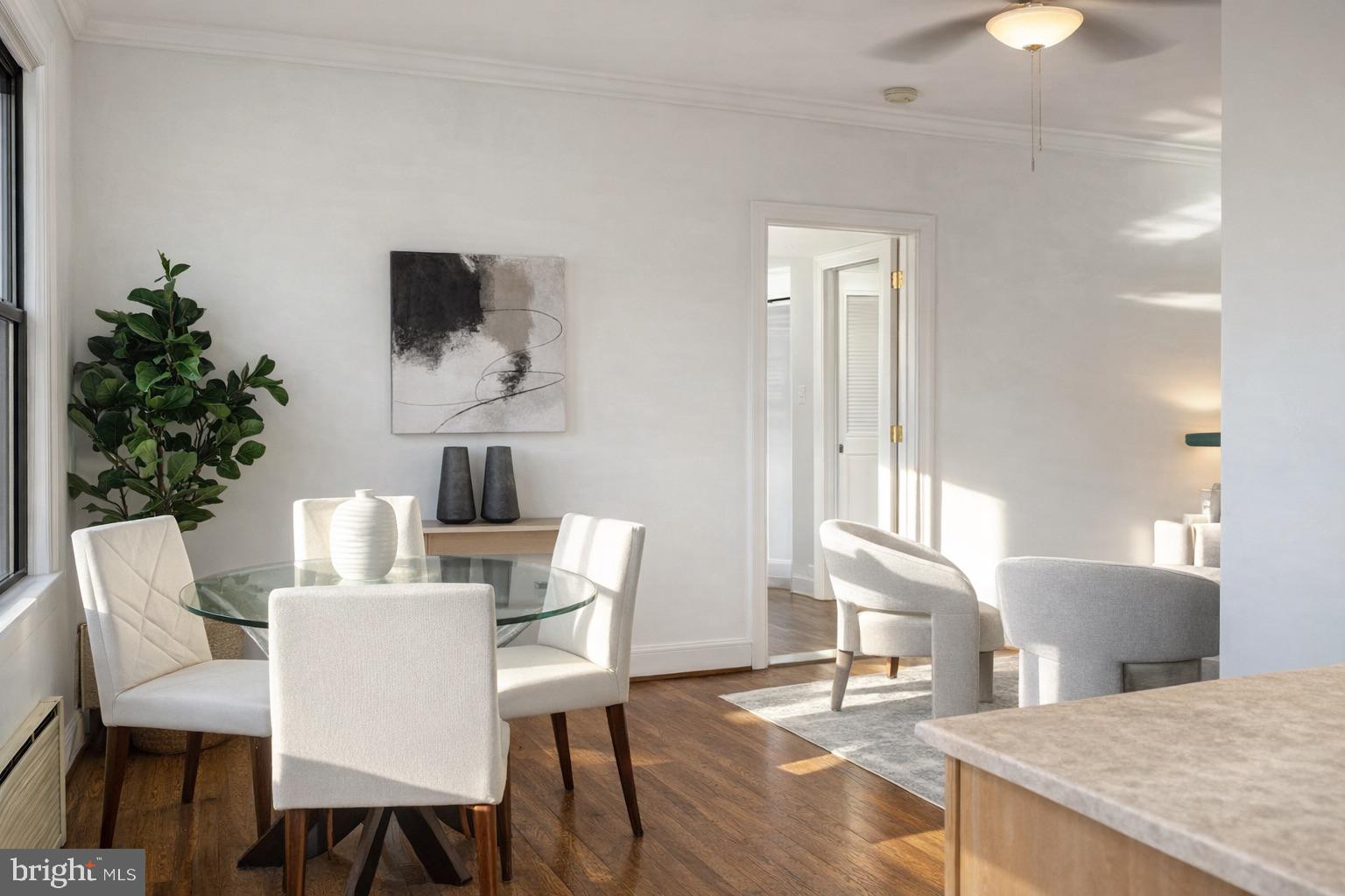 3616 Connecticut Avenue Northwest, Unit 408 Washington, DC 20008 - Photo 6 of 16 a view of a dining room with furniture and wooden floor