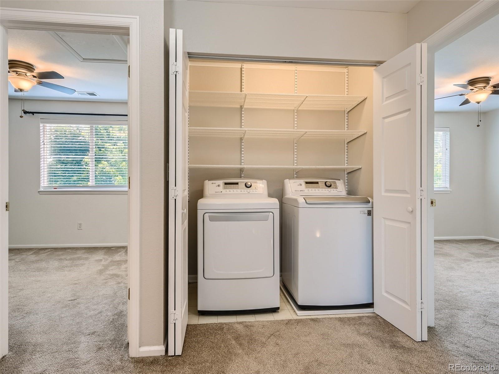 10574 Tracewood Circle Highlands Ranch, CO 80130 - Photo 17 of 21 a utility room with dryer and washer