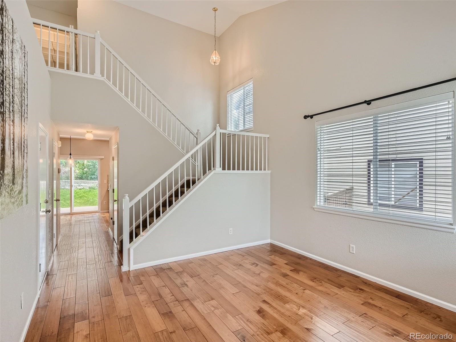 10574 Tracewood Circle Highlands Ranch, CO 80130 - Photo 3 of 21 a view of an entryway with wooden floor