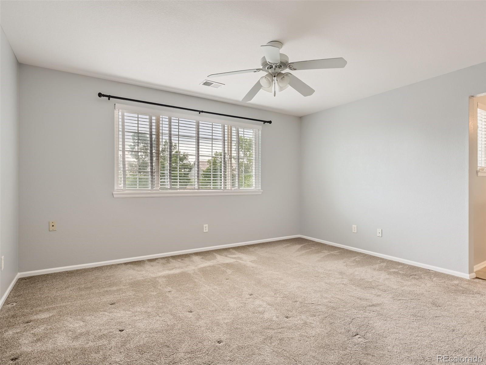 10574 Tracewood Circle Highlands Ranch, CO 80130 - Photo 9 of 21 a view of an empty room with a window