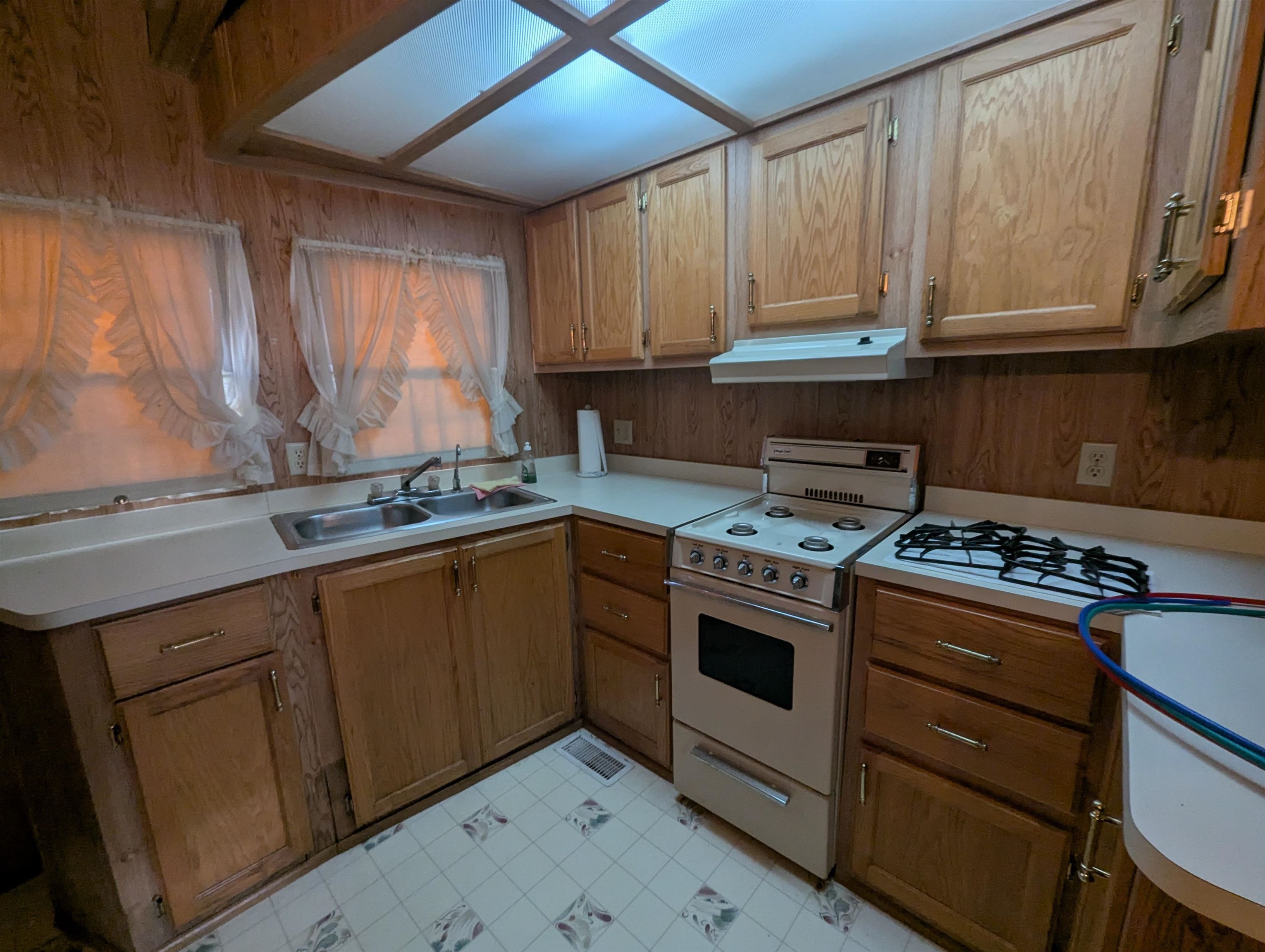 57 Elm Woodbine, NJ 08270 - Photo 7 of 11 a kitchen with stainless steel appliances granite countertop a stove and a sink