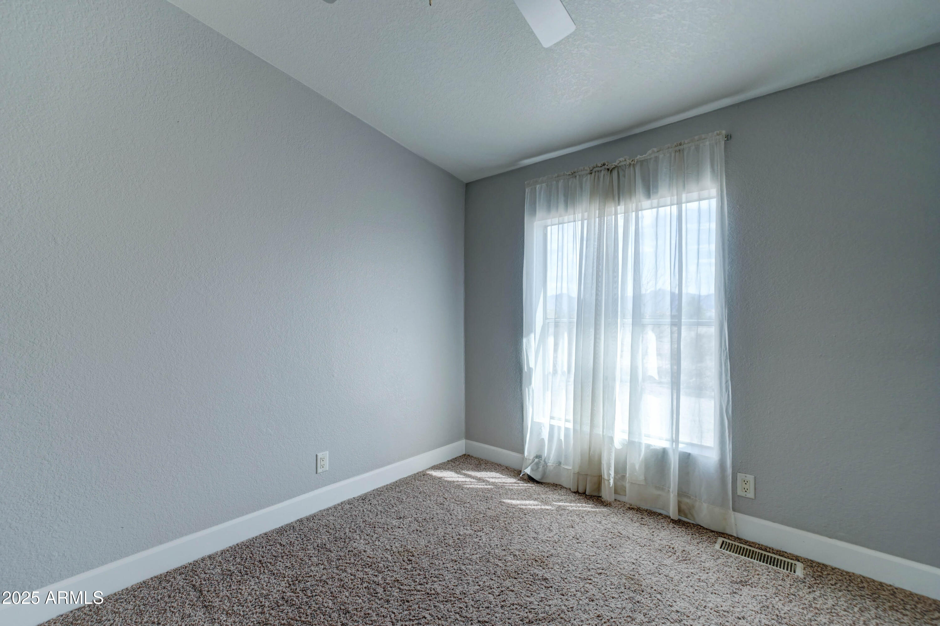 23402 South Manzanilla Road Buckeye, AZ 85326 - Photo 20 of 46 an empty room with windows
