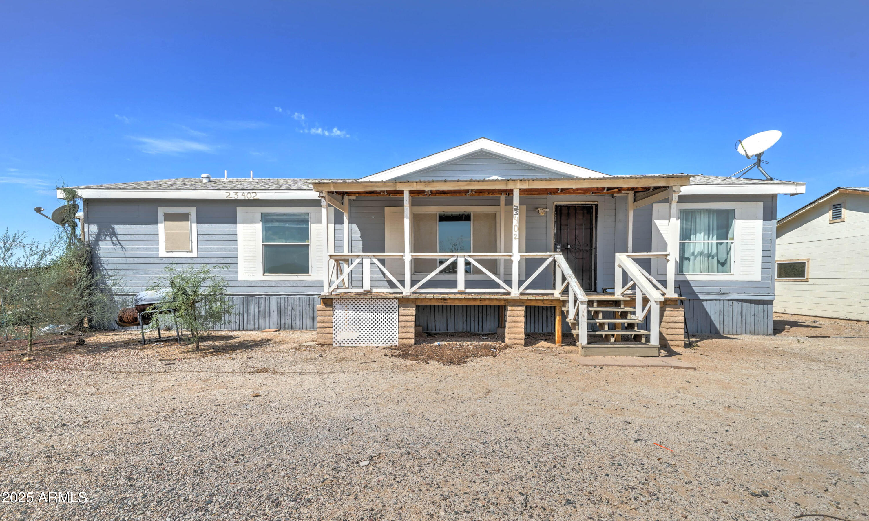 23402 South Manzanilla Road Buckeye, AZ 85326 - Photo 2 of 46 a front view of a house with a yard