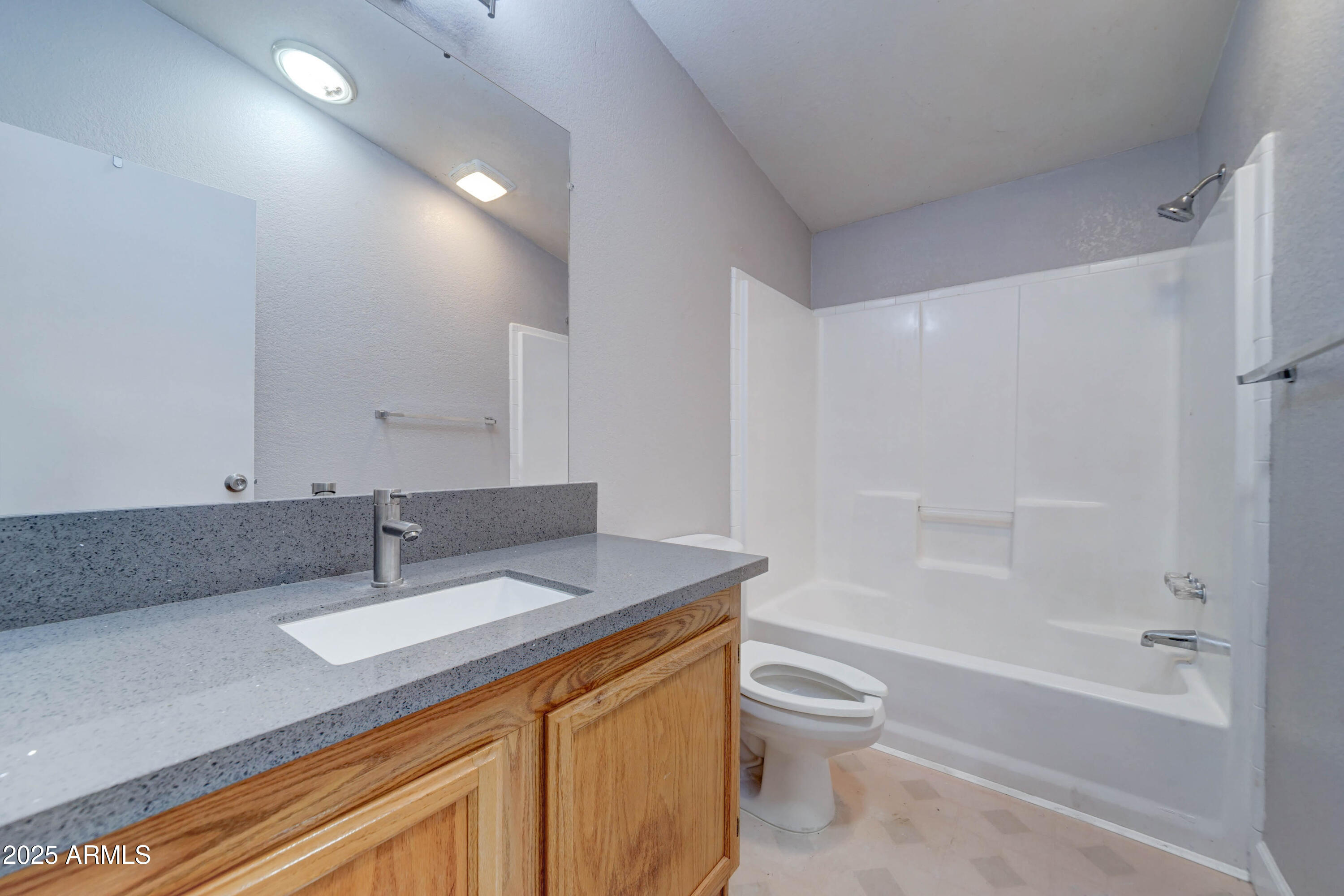 23402 South Manzanilla Road Buckeye, AZ 85326 - Photo 21 of 46 a bathroom with a granite countertop sink toilet and shower