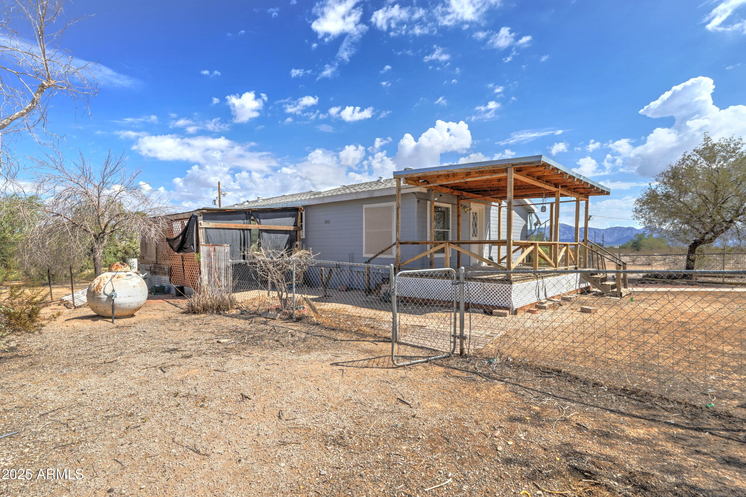 23402 South Manzanilla Road Buckeye, AZ 85326 - Photo 26 of 46 a view of a house with backyard porch and sitting area