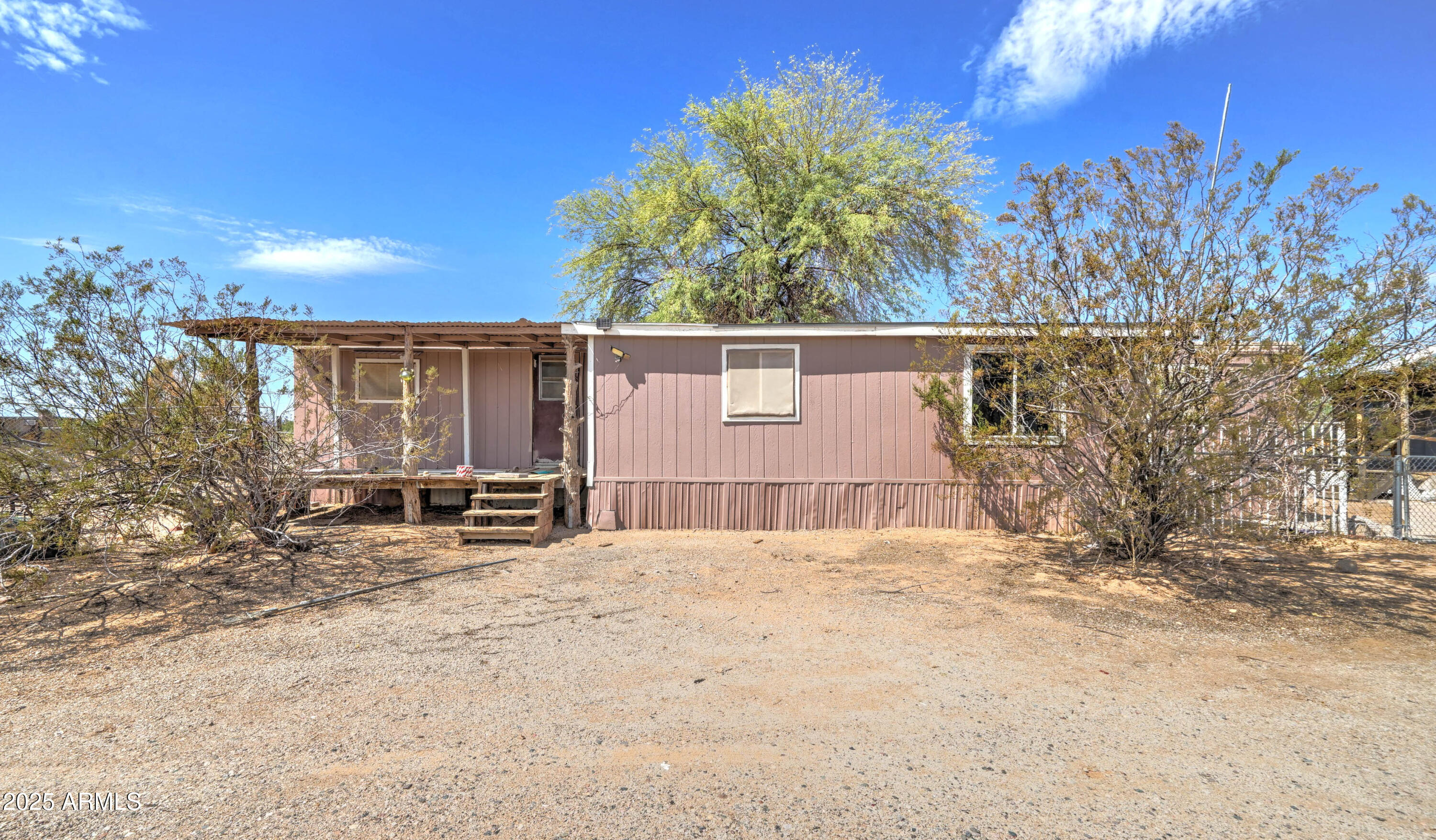 23402 South Manzanilla Road Buckeye, AZ 85326 - Photo 28 of 46 a view of a house with a snow in the background