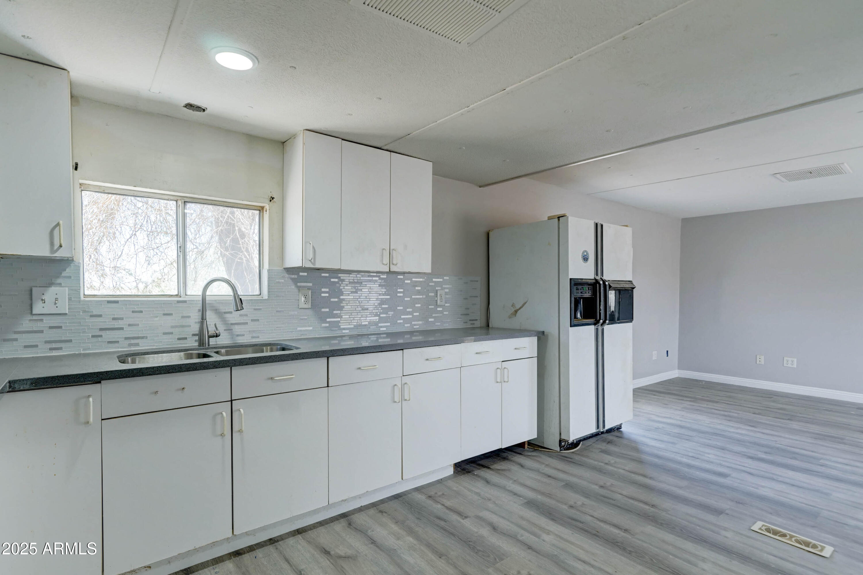 23402 South Manzanilla Road Buckeye, AZ 85326 - Photo 35 of 46 a kitchen with sink and cabinets