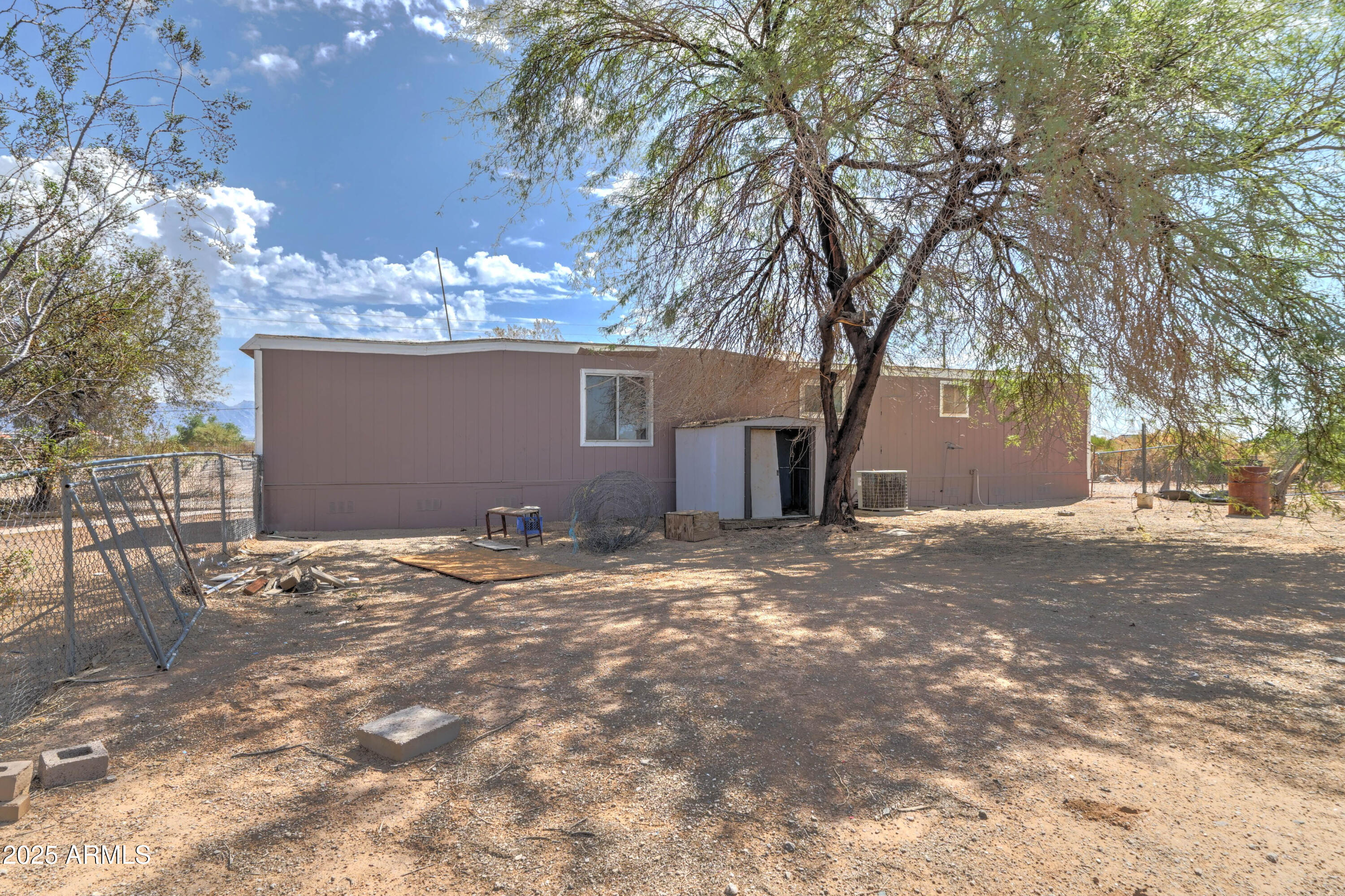23402 South Manzanilla Road Buckeye, AZ 85326 - Photo 40 of 46 a view of a house with a yard and garage