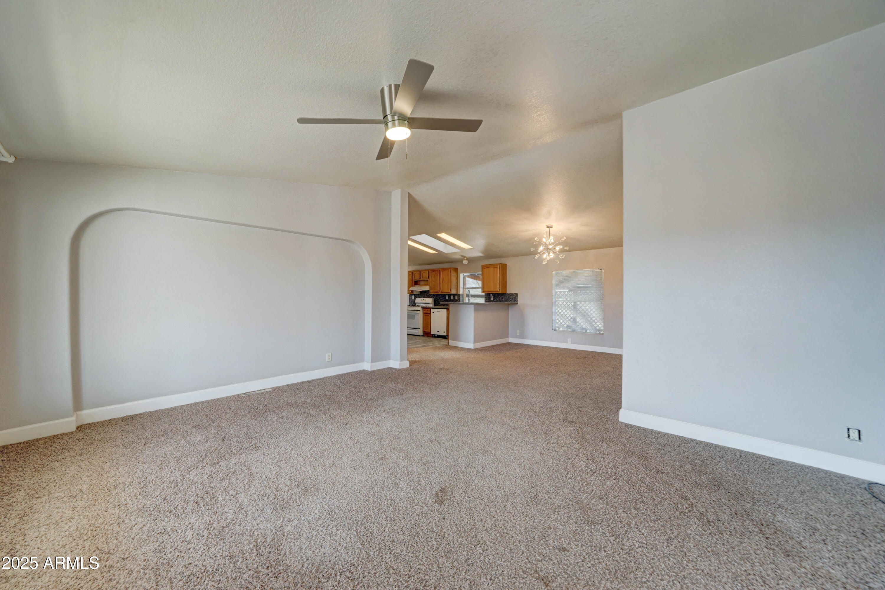 23402 South Manzanilla Road Buckeye, AZ 85326 - Photo 4 of 46 a view of empty room with wooden floor