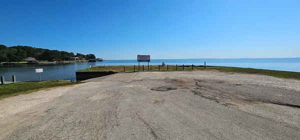 a view of a patio with a table & chairs