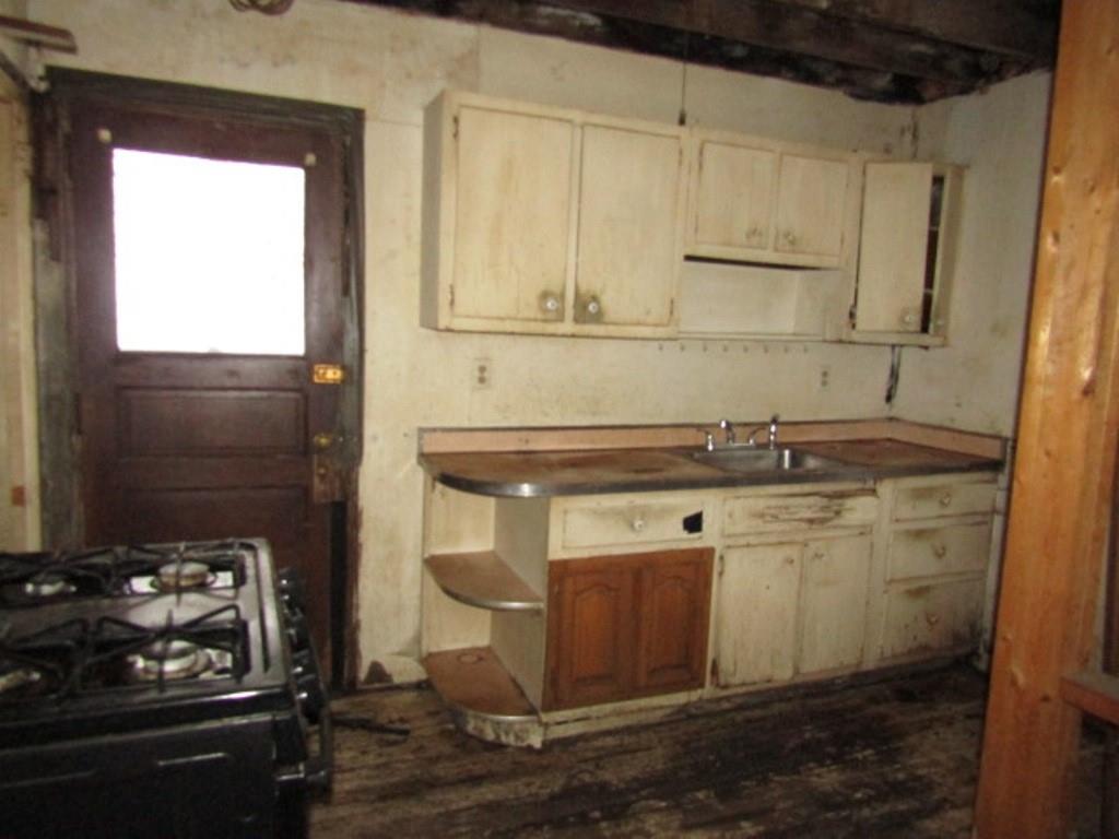 234 Spring Run Road Crescent, PA 15046 - Photo 10 of 24 a kitchen with a sink stove and cabinets