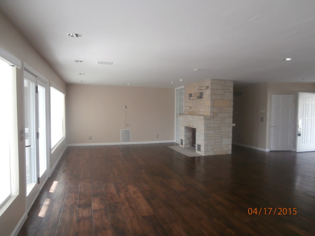 3163 River Road Kankakee, IL 60901 - Photo 6 of 17 a view of empty room with wooden floor and fireplace