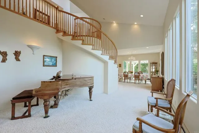 a view of kitchen with furniture and a living room