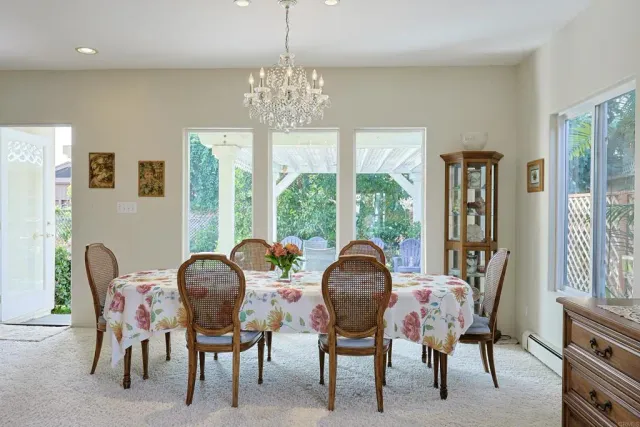 a large kitchen with a table and chairs