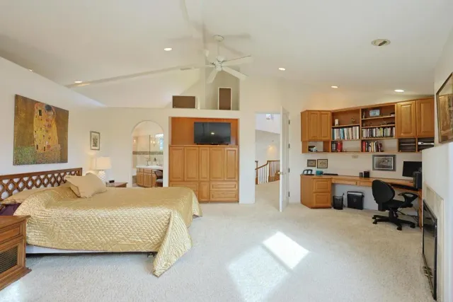 a front view of a house with a garden and plants