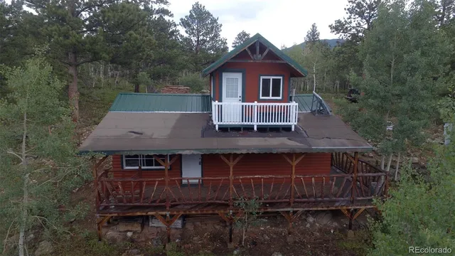 a view of outdoor space with wooden floor and windows