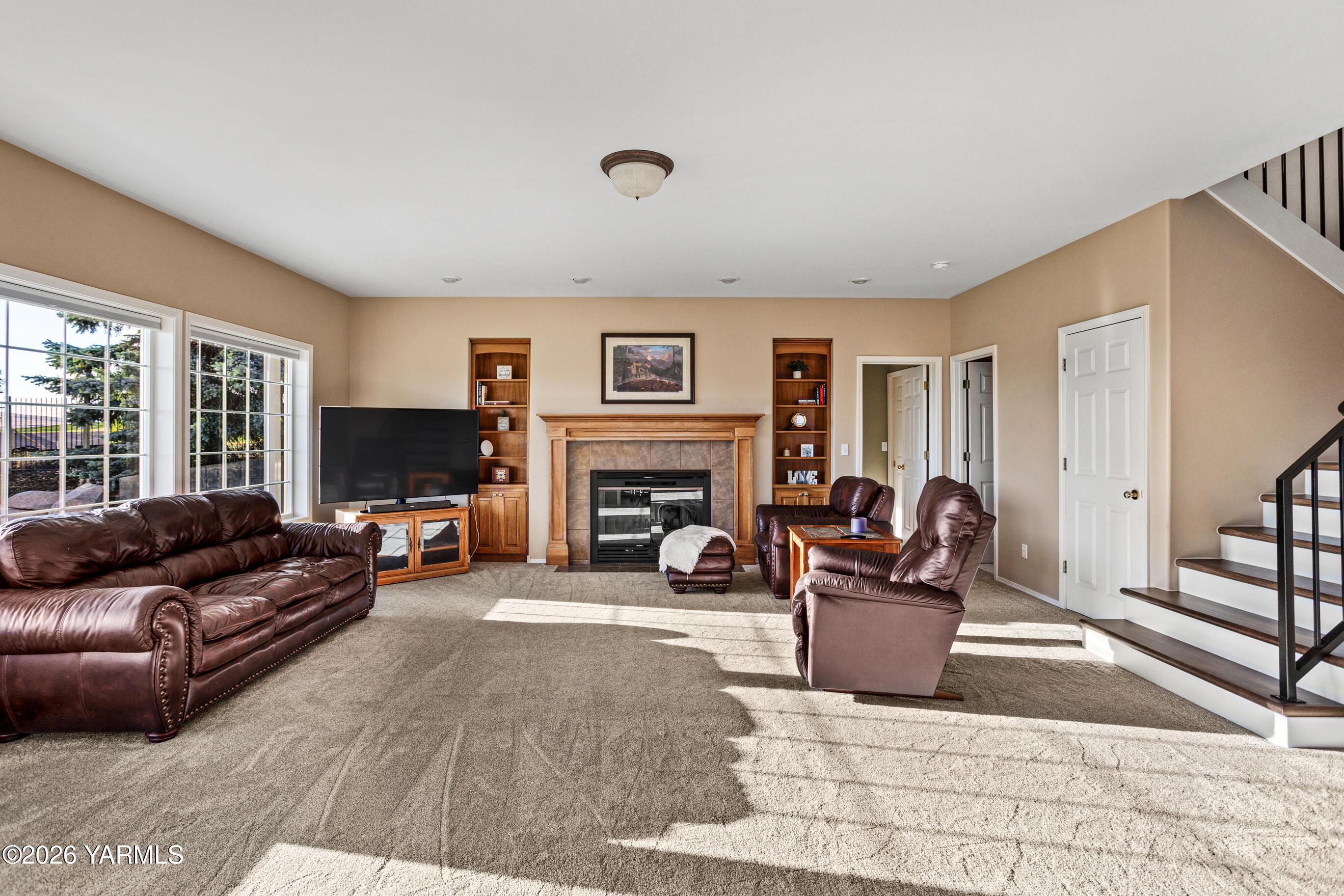 5060 Lombard Loop Road Zillah, WA 98953 - Photo 15 of 65 a living room with furniture flat screen tv and a fireplace